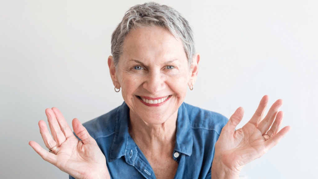 laughing elderly woman clapping