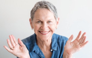laughing elderly woman clapping