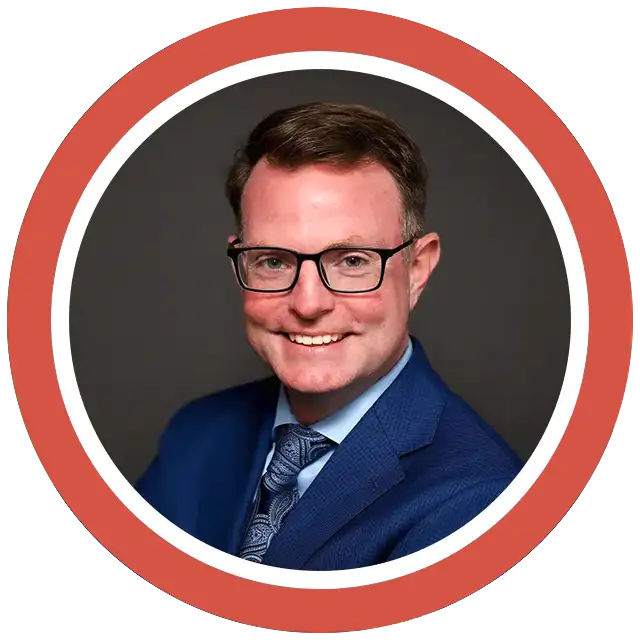 photo of Tim Shanahan in a blue suit