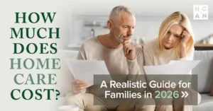 Middle-aged couple reviewing paperwork at home while discussing how to pay for home care costs.